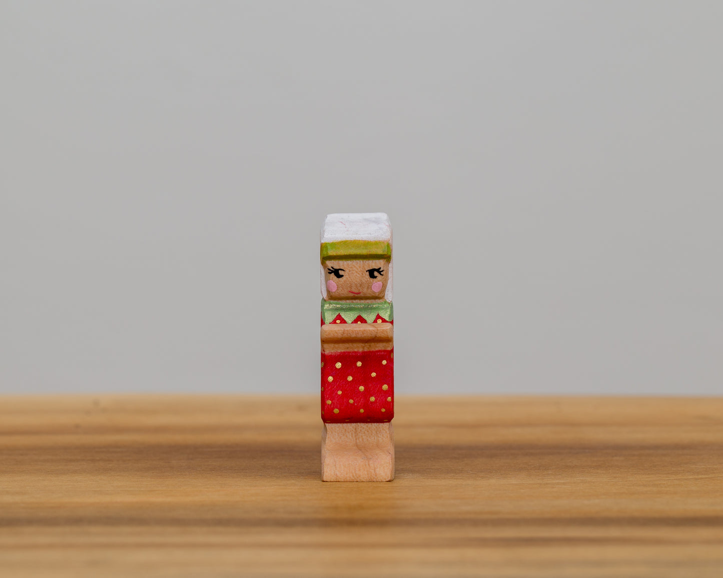 Short Strawberry Child with stationary arms and little ponytail