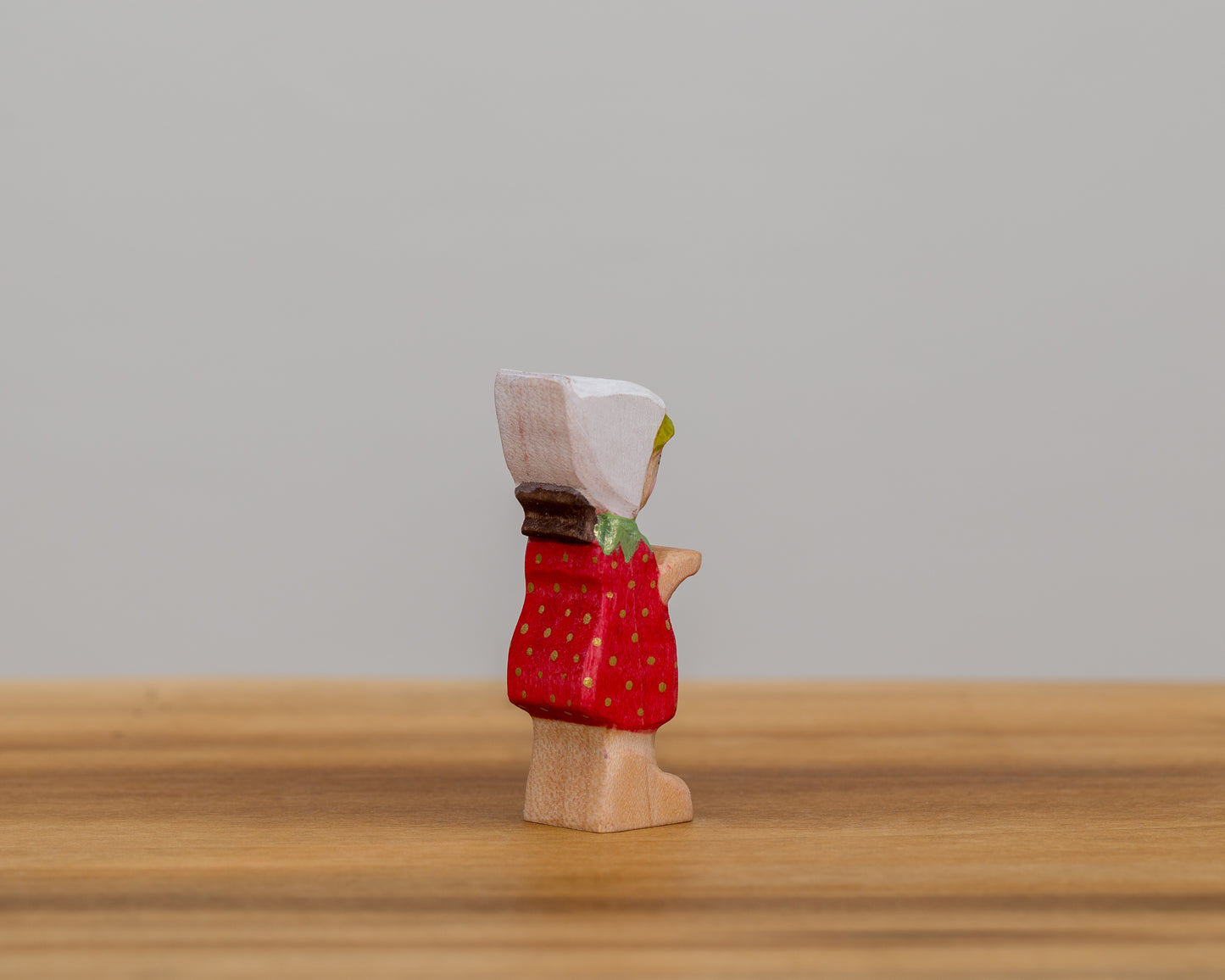 Short Strawberry Child with stationary arms and little ponytail