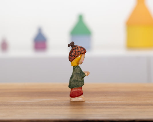 Short Acorn child with blond hair in pants