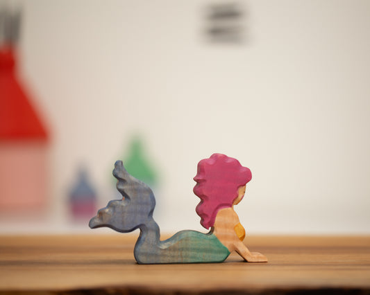 Adult swimming mermaid with green/blue tail and pink hair
