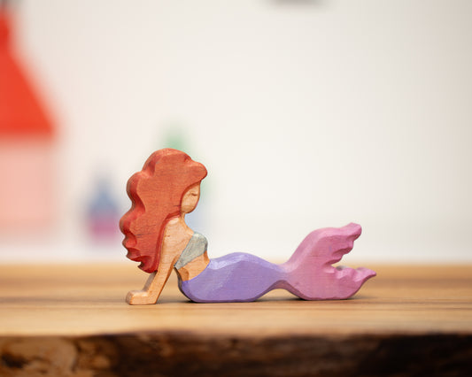 Adult reclining mermaid purple/pink with auburn hair