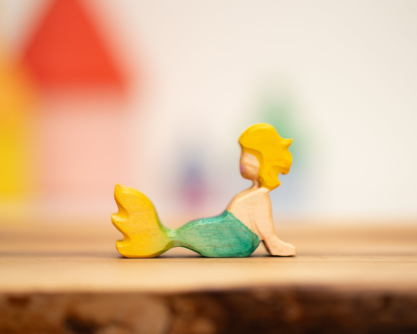 Reclining yellow/green mermaid with blond hair
