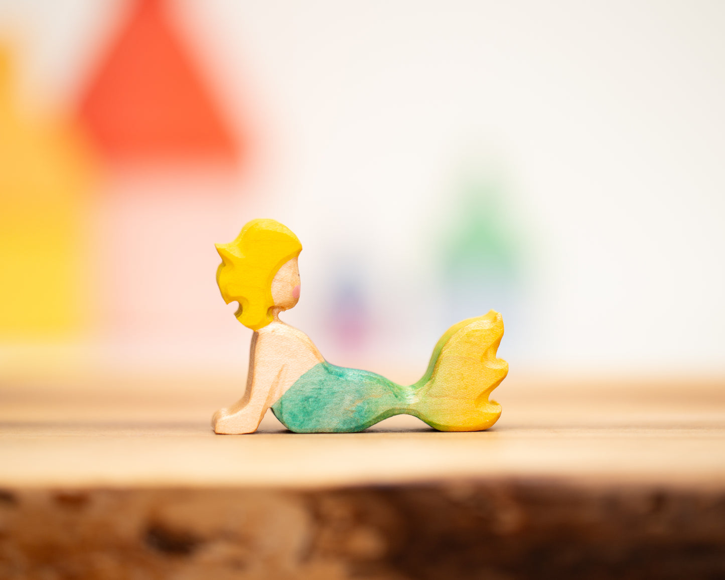 Reclining yellow/green mermaid with blond hair