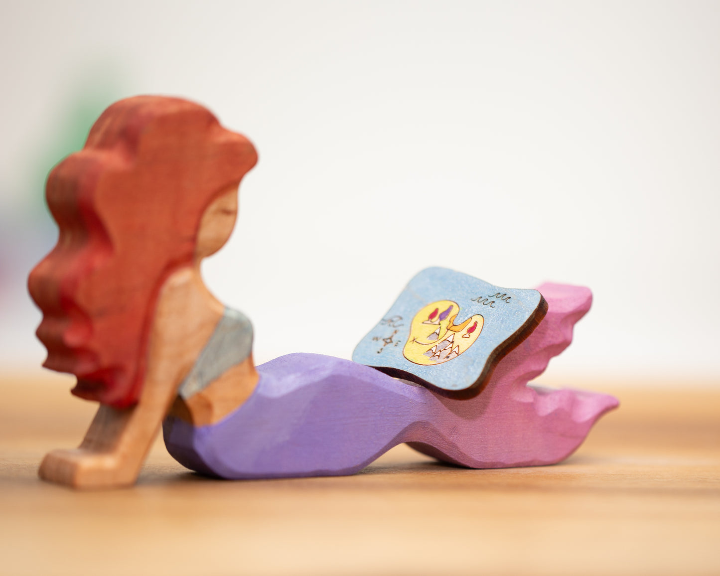 Adult reclining mermaid purple/pink with auburn hair