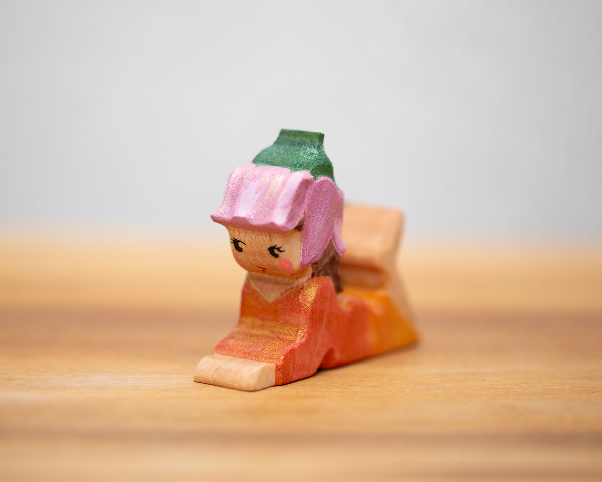 Laying down peach child