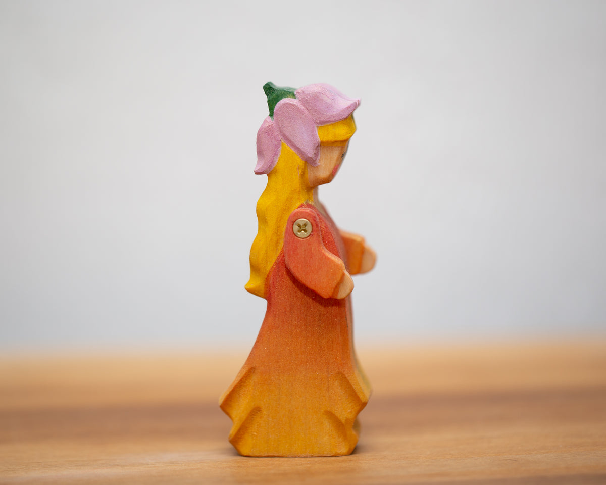 Peach Child in Dress with moving arms