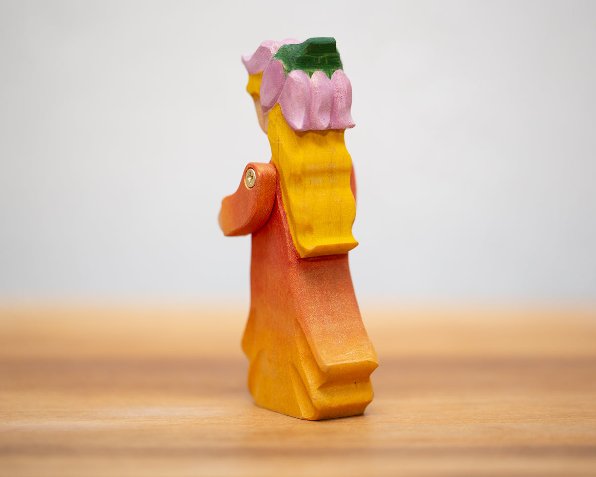 Peach Child in Dress with moving arms