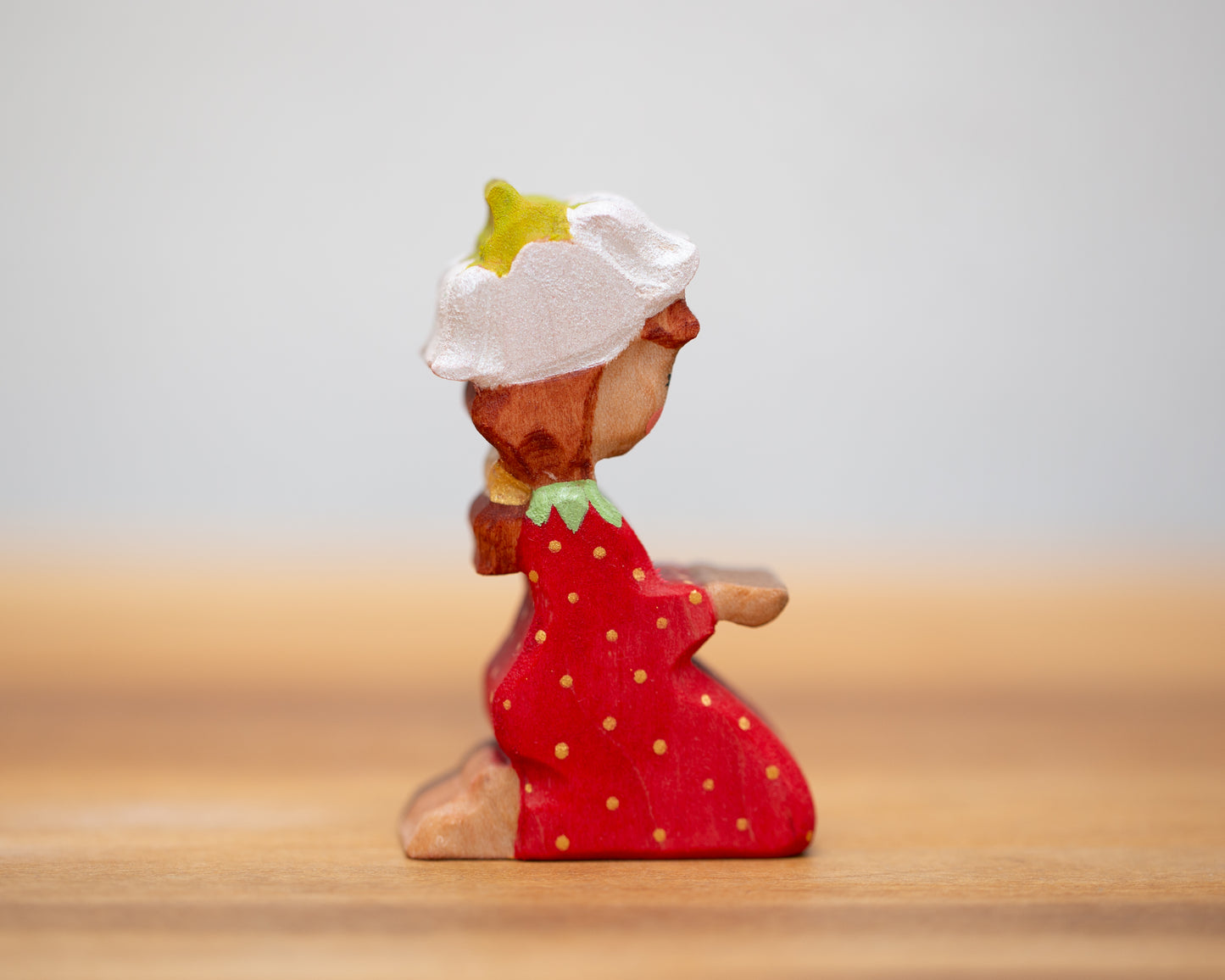 Kneeling strawberry child