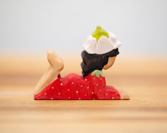 Laying down strawberry child